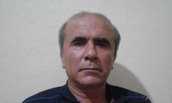 Odasında başından silahla vurulmuş halde ölü bulundu