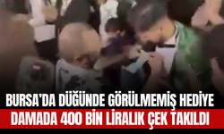 Bursa’da Düğünde Görülmemiş Hediye: Damada 400 Bin Liralık Çek Takıldı