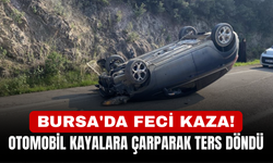 Bursa'da feci kaza! Otomobil kayalara çarparak ters döndü