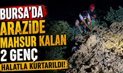 Bursa'da arazide mahsur kalan 2 genç halatla kurtarıldı