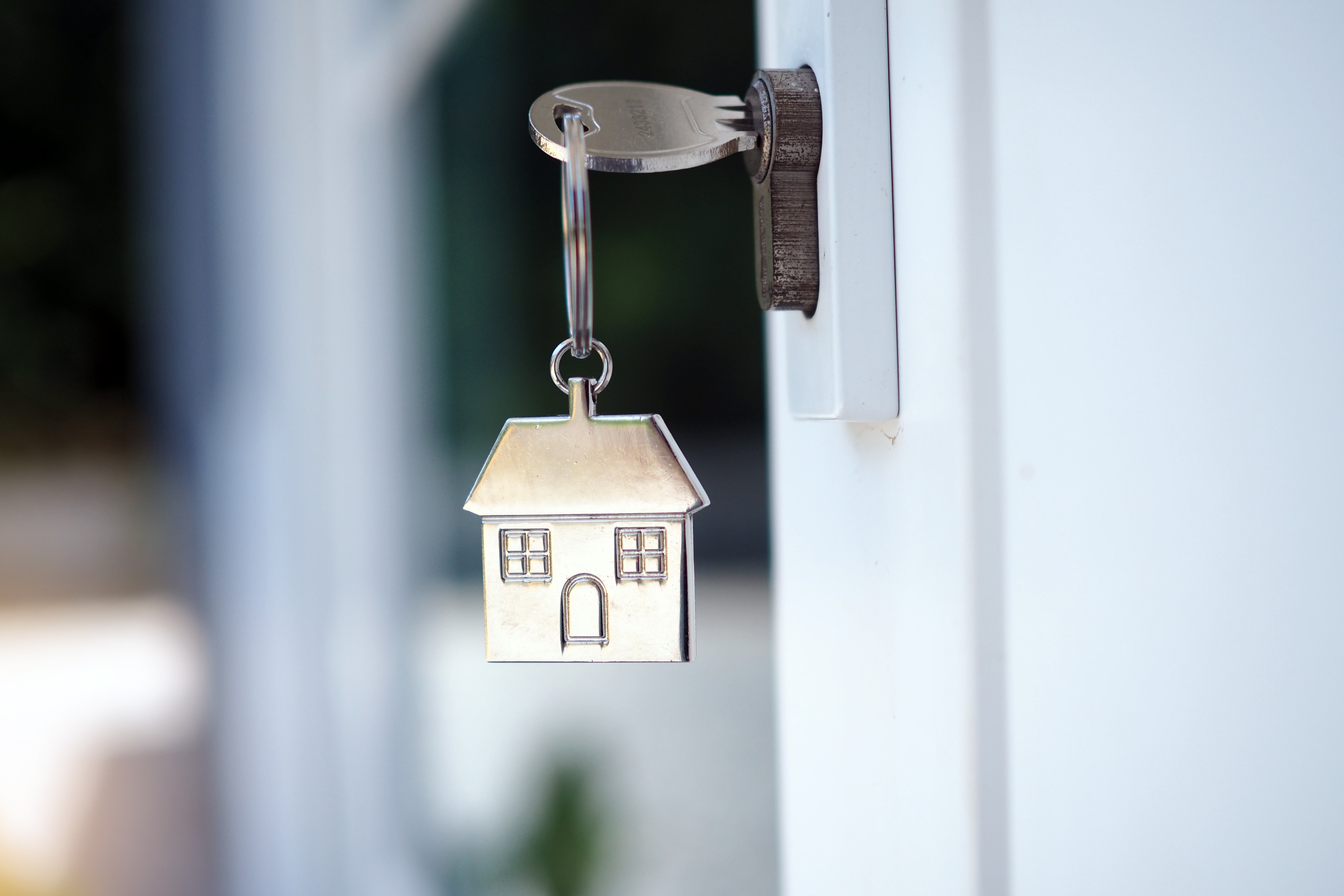 home-key-unlocking-new-house-door-renting-buying-selling-houses