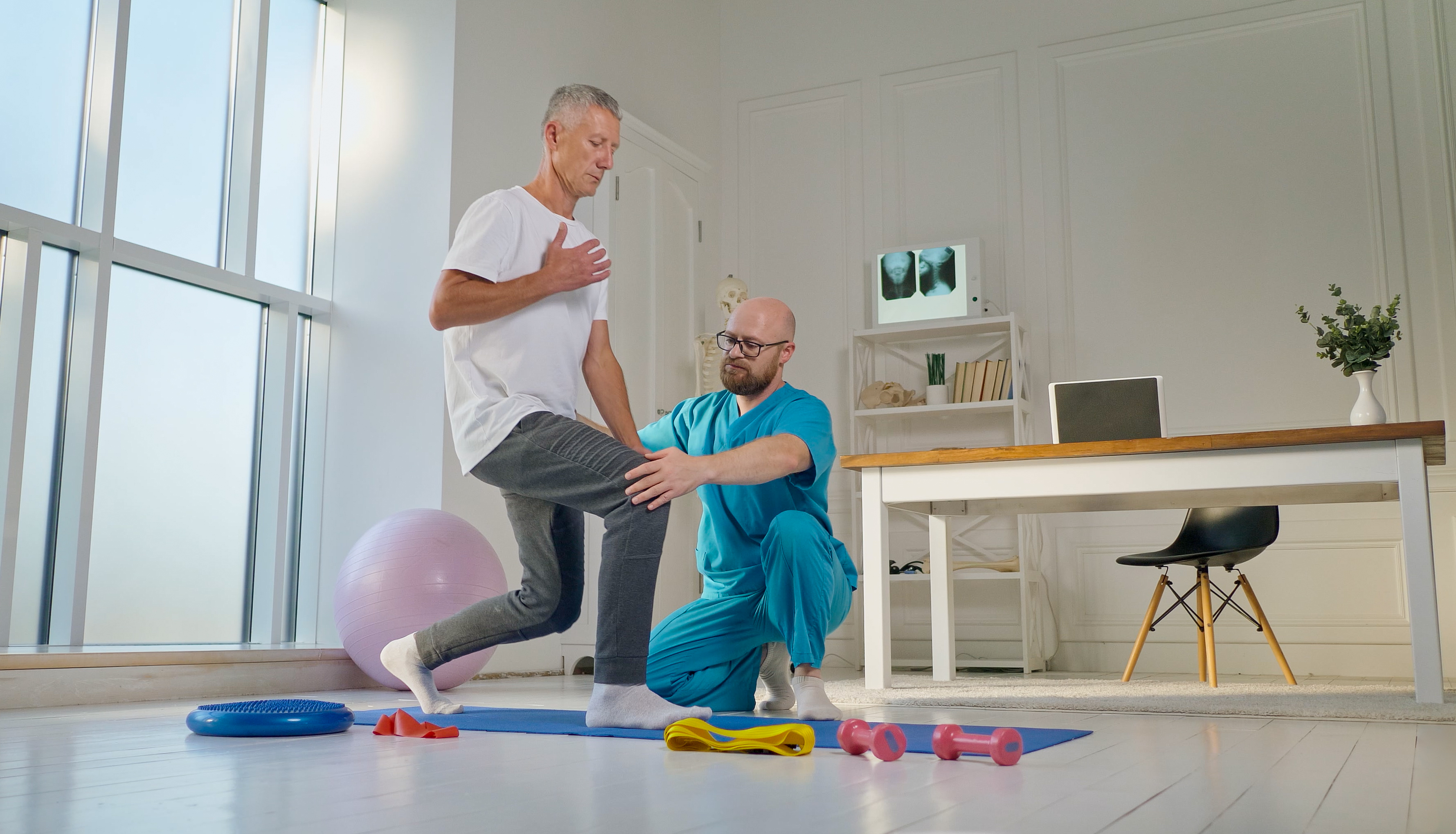 physical-therapist-safely-trains-patient-using-medical-exercise-equipment-rehabilitation