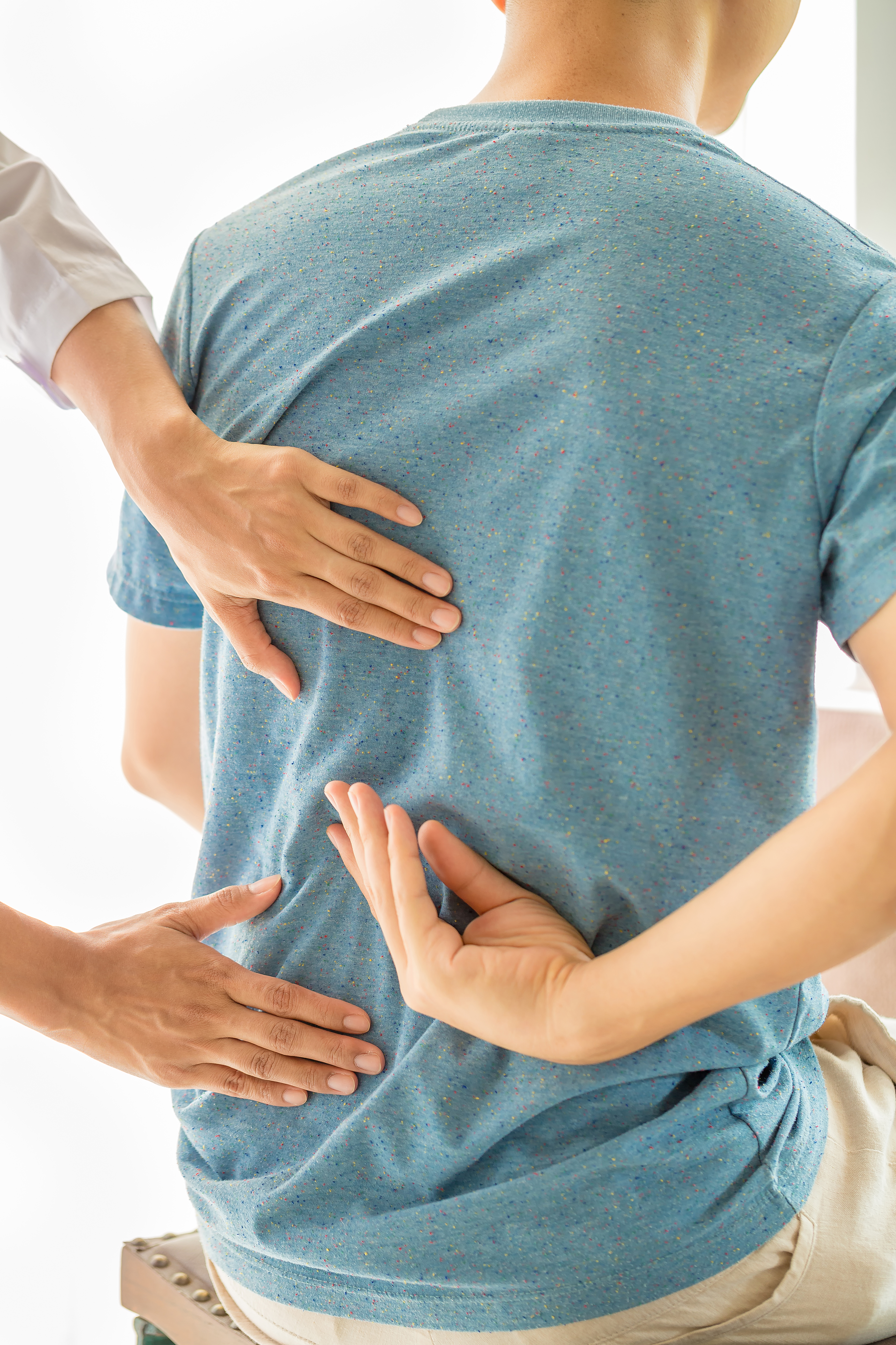 close-up-physiotherapist-working-with-patient-clinic