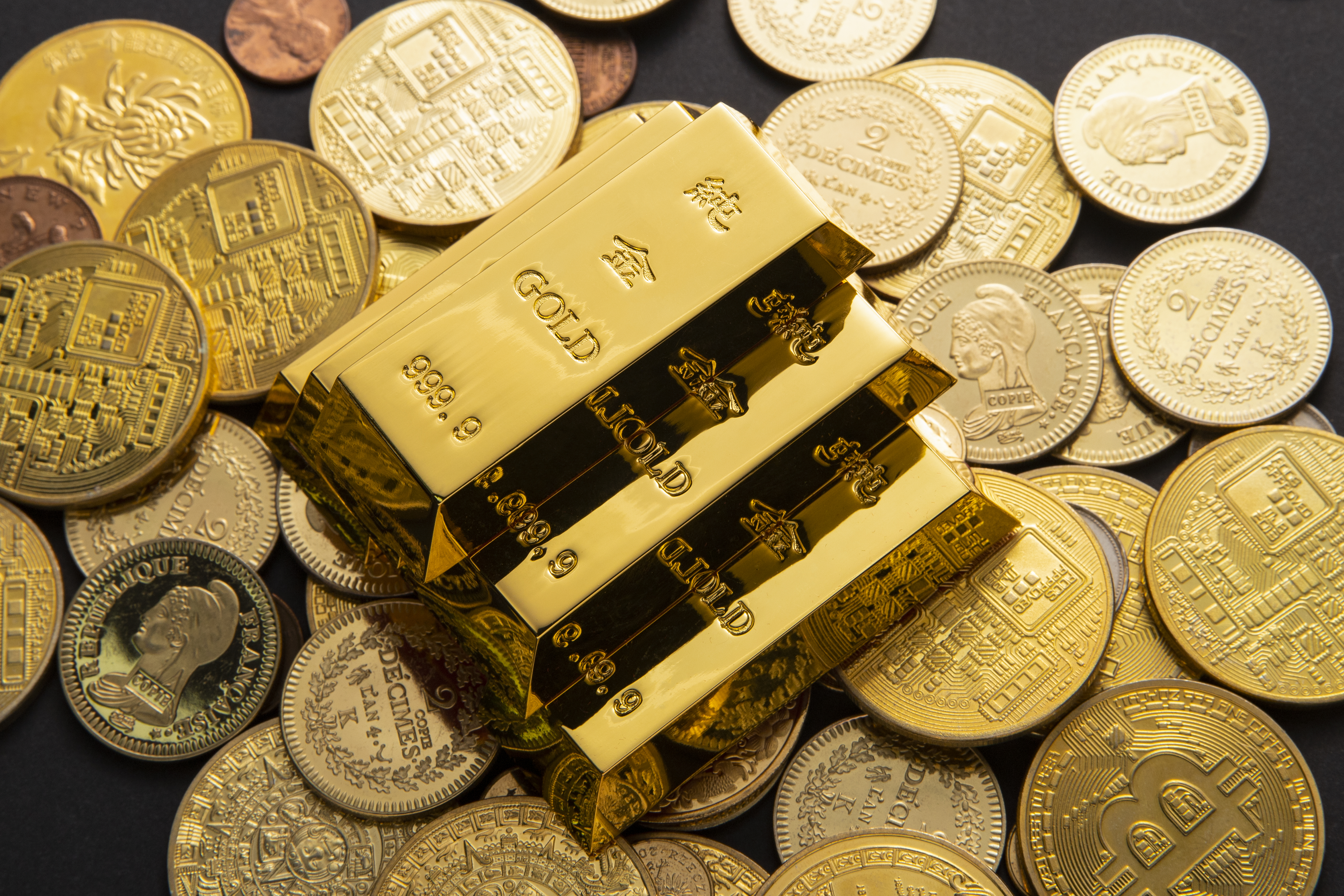 closeup-shot-pile-shiny-gold-coins-bars