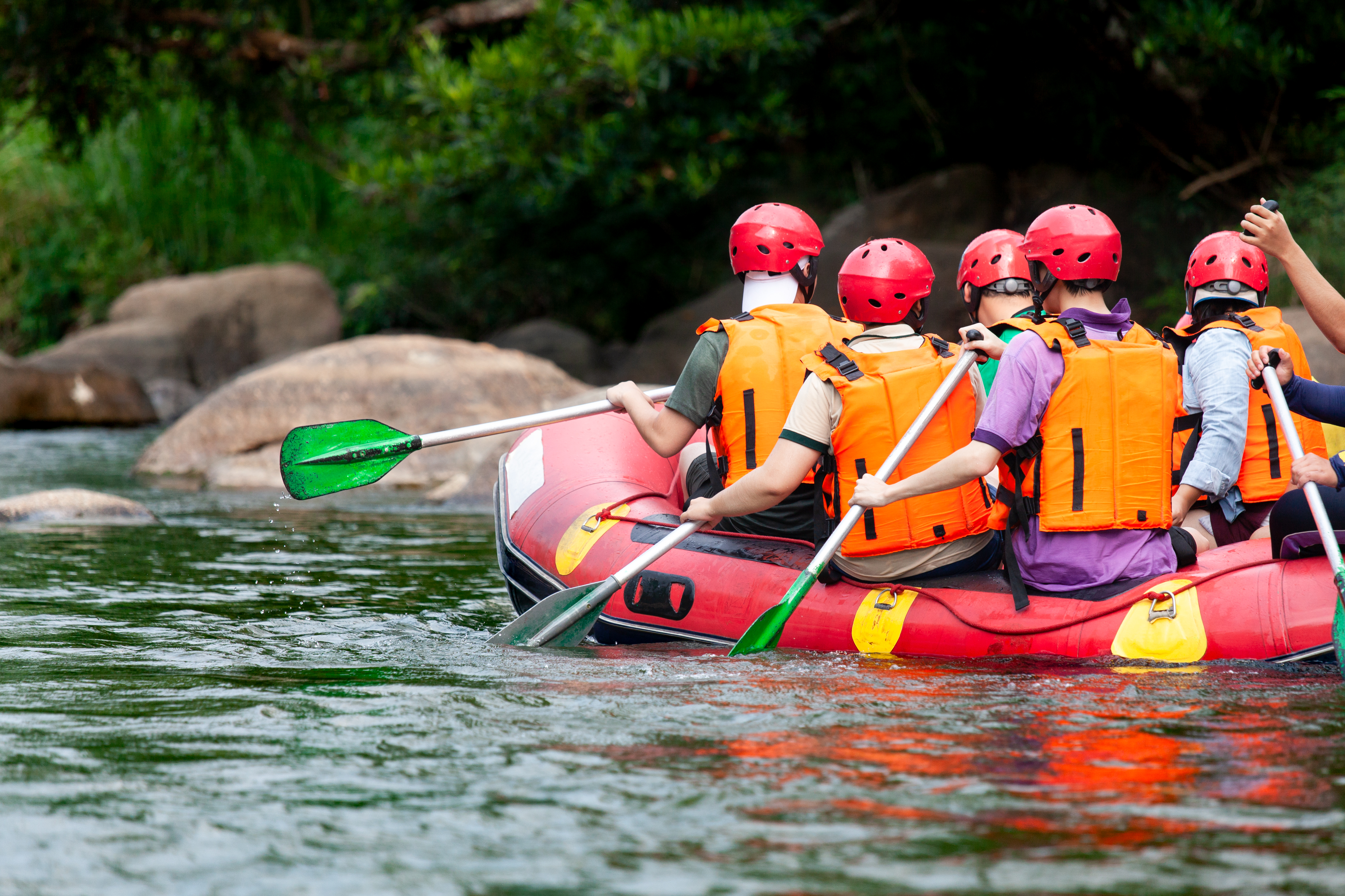 group-young-person-rafting-river
