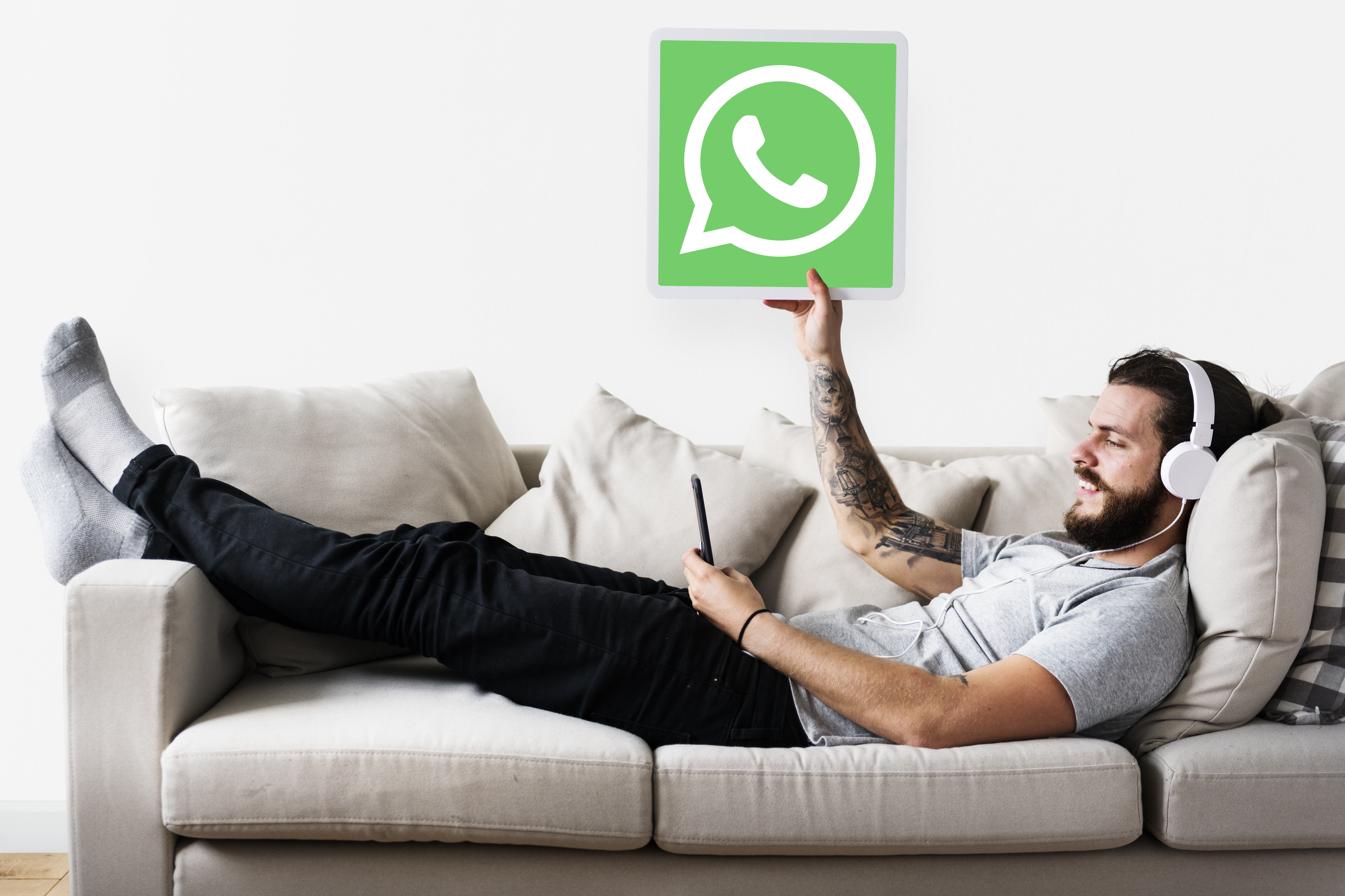 man-showing-whatsapp-messenger-icon