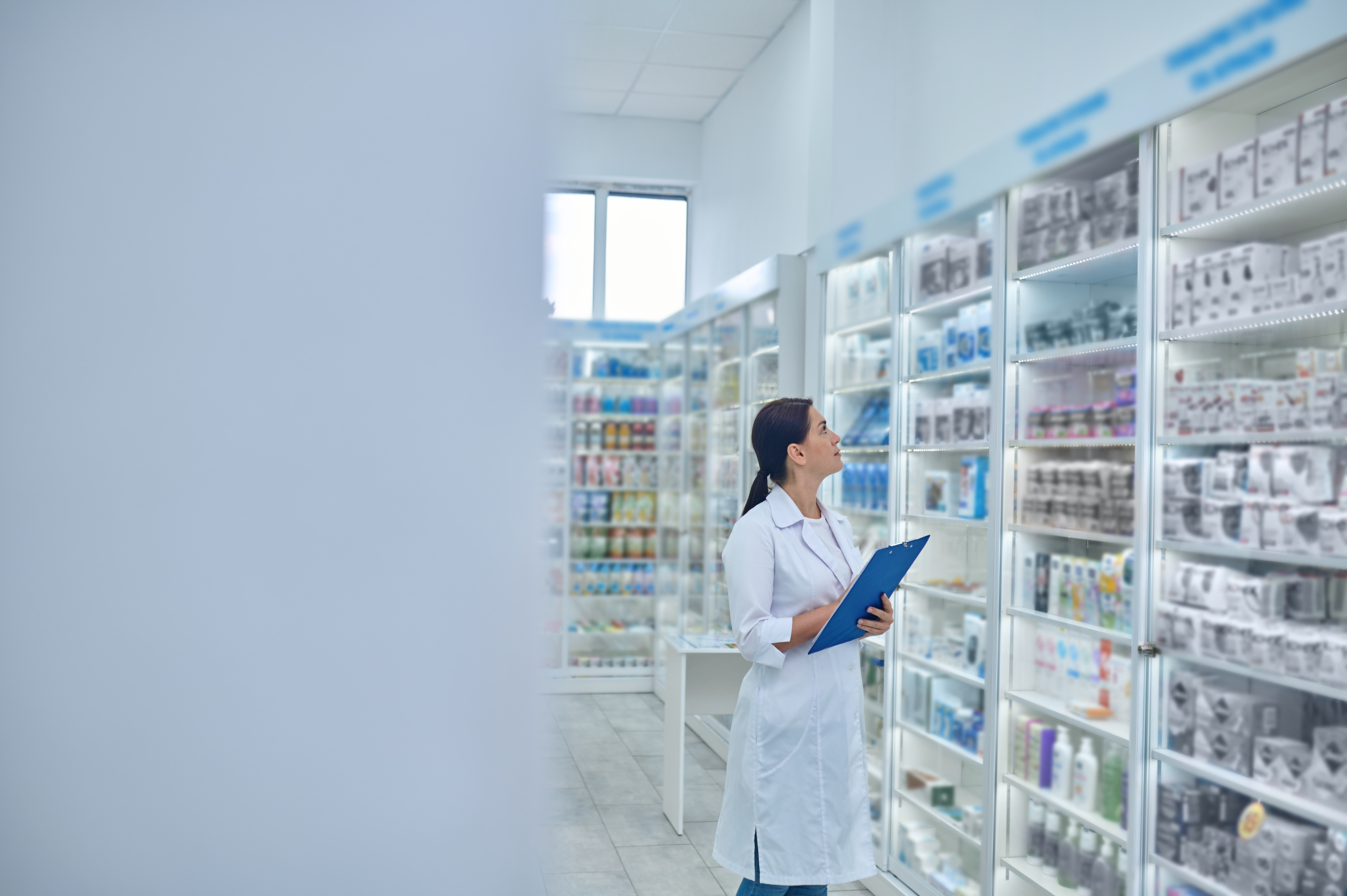 pharmacist-checking-medicines-drugstore