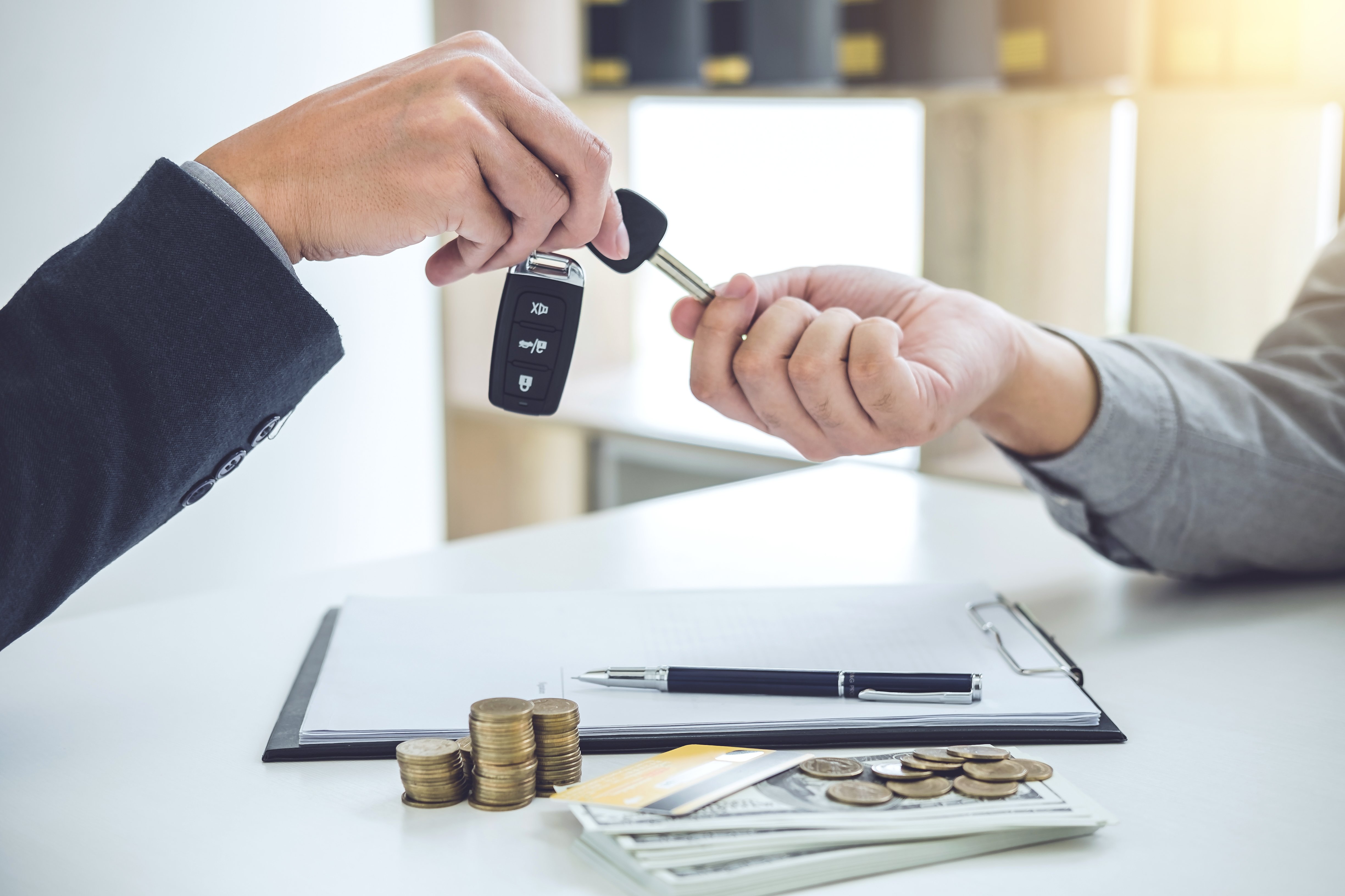salesman-send-key-customer-after-good-deal-agreement-successful-car-loan-contract