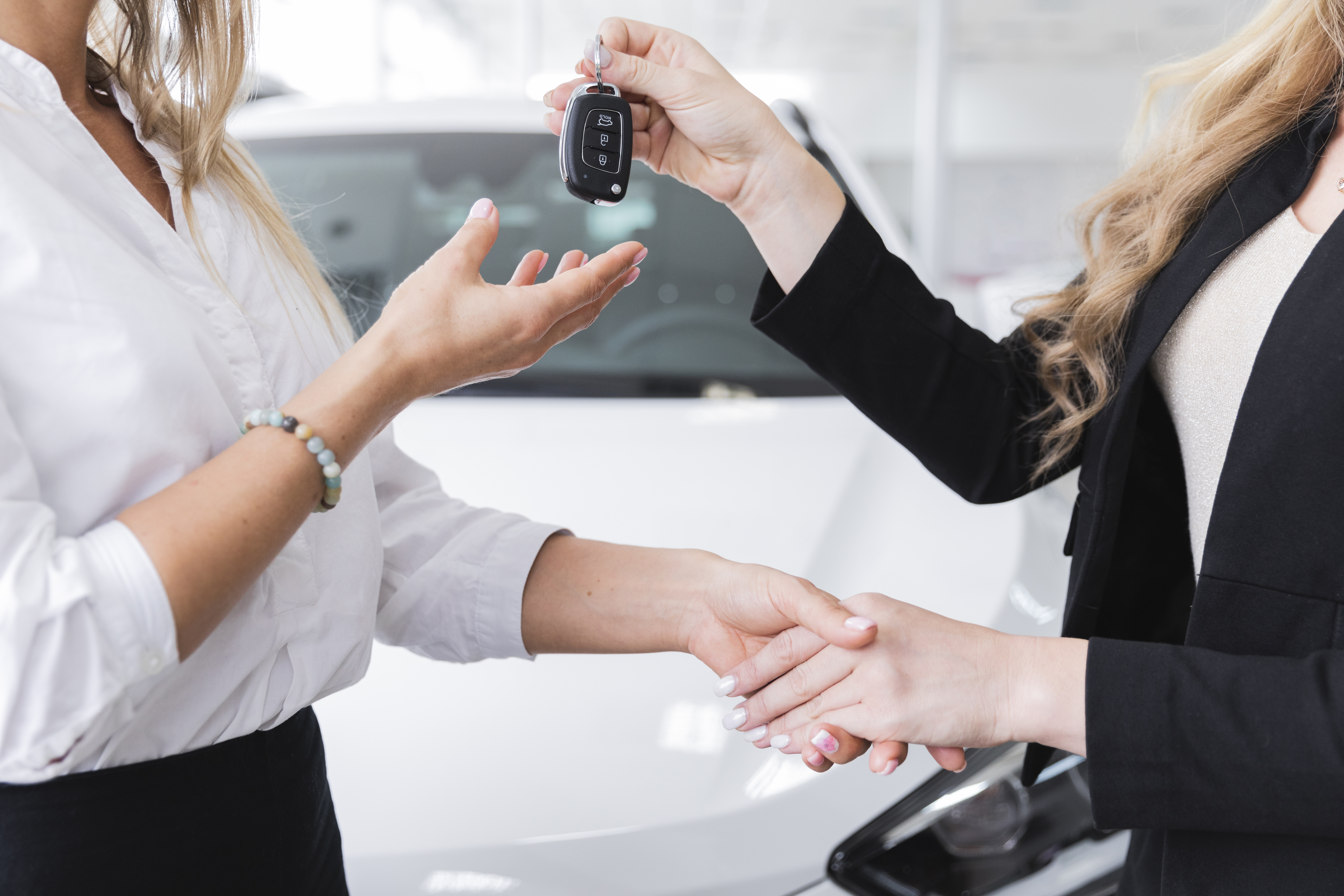 side-view-woman-receiving-car-keys