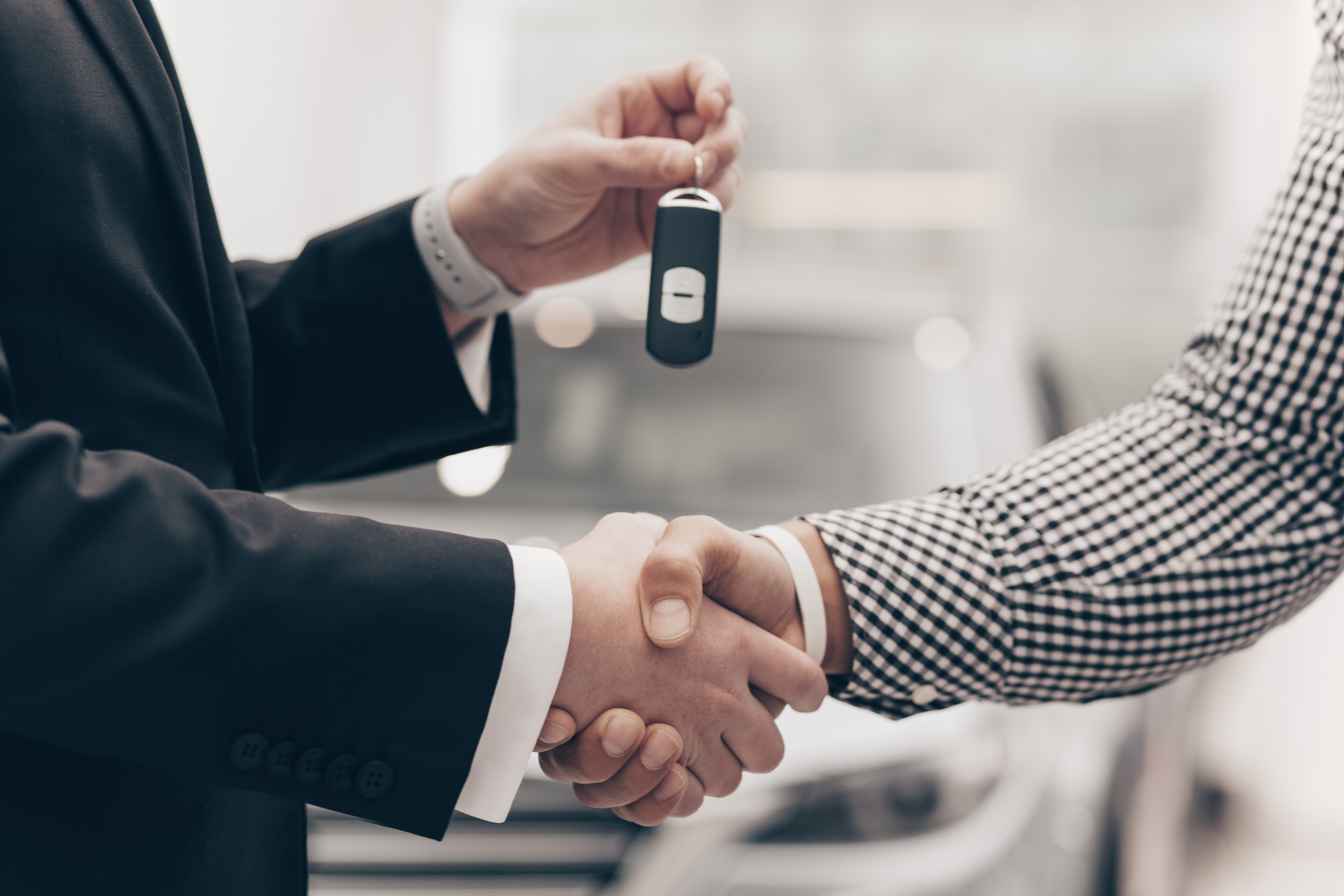 car-salesman-working-with-customer-dealership