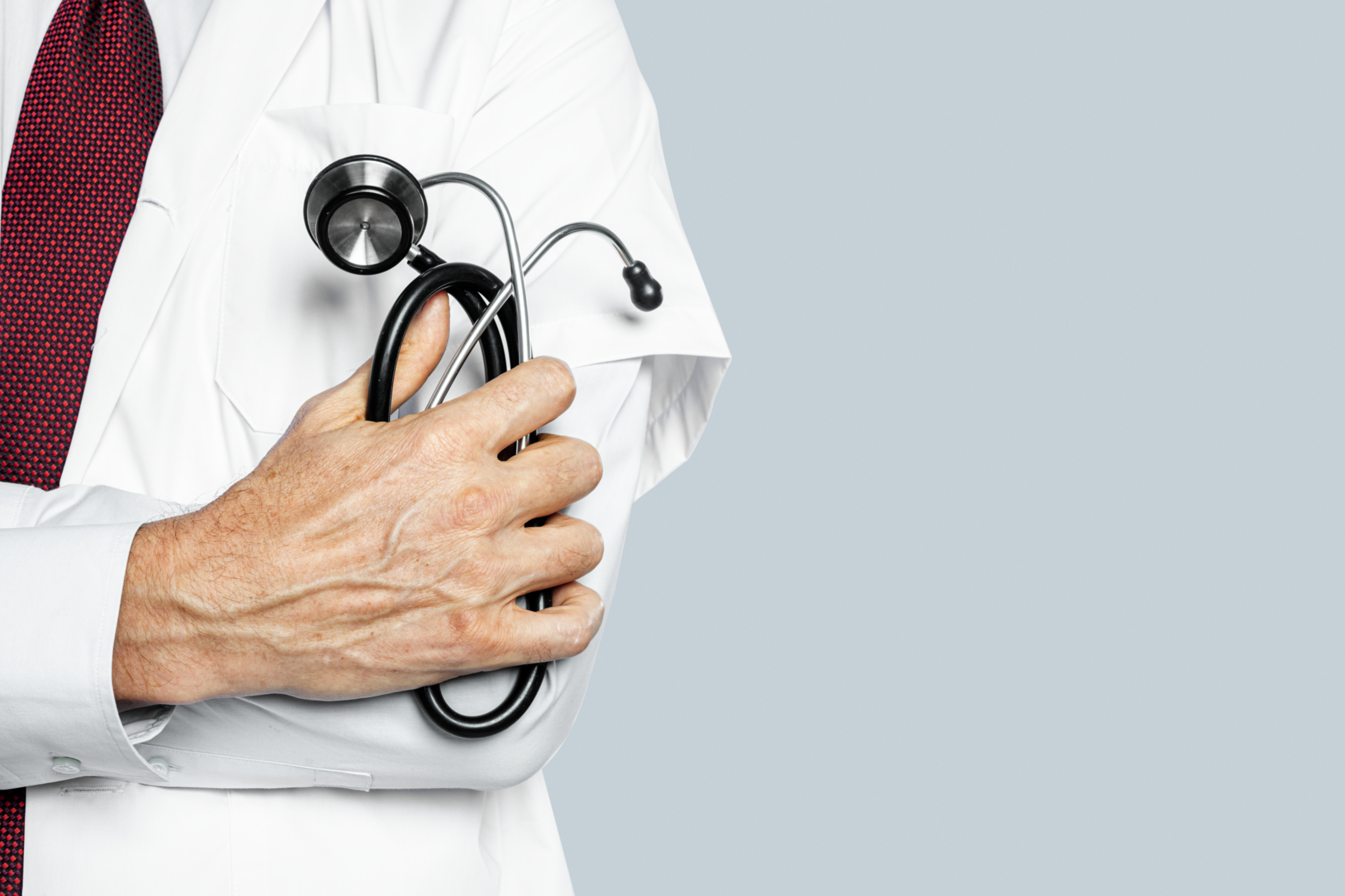 doctor-s-hand-holding-stethoscope-closeup