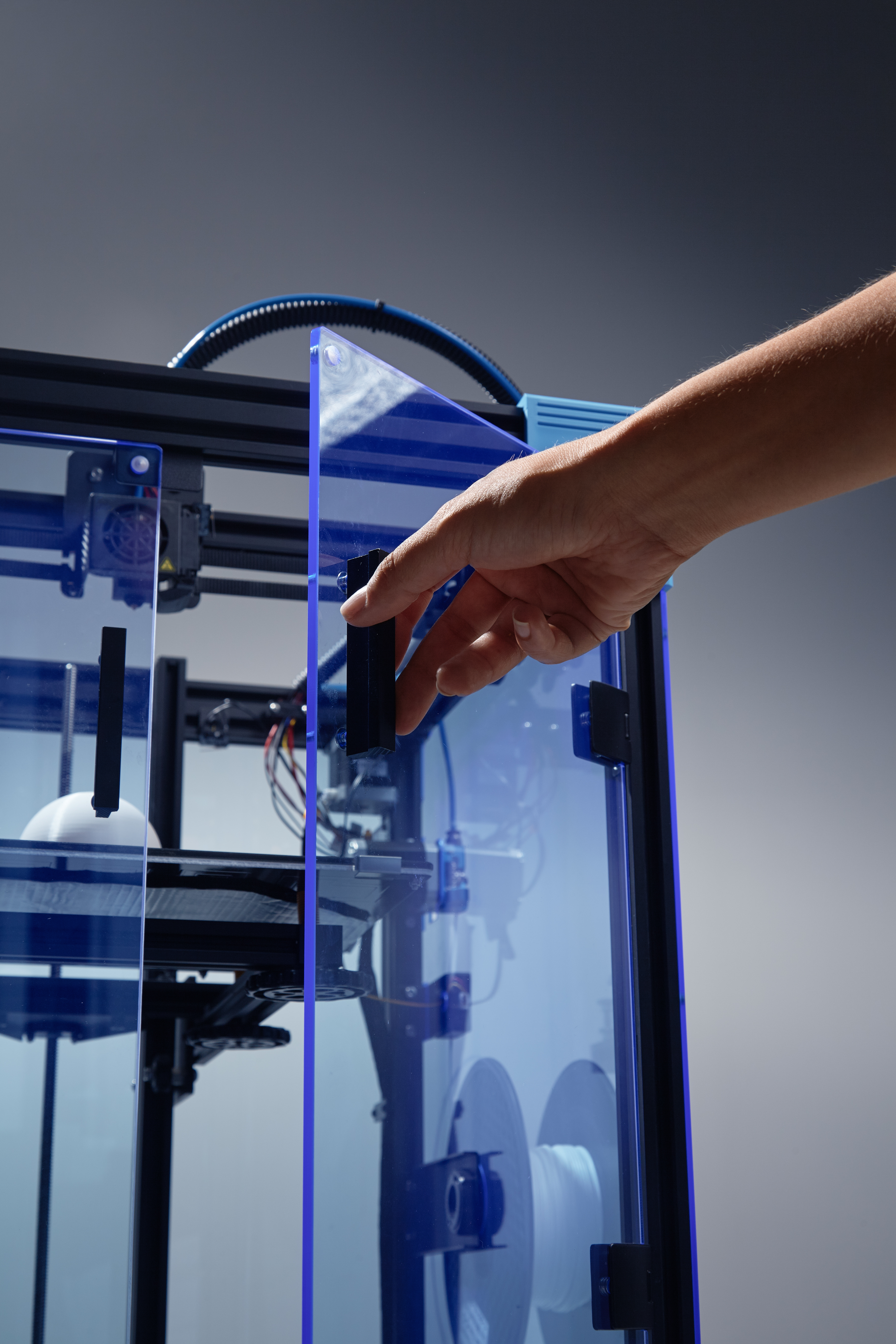 futuristic-concept-new-working-possibilities-small-businesses-by-3d-printing-genderneutral-hand-open-window-printer-access-prototype-made-from-recycled-plastic-jpg-photo