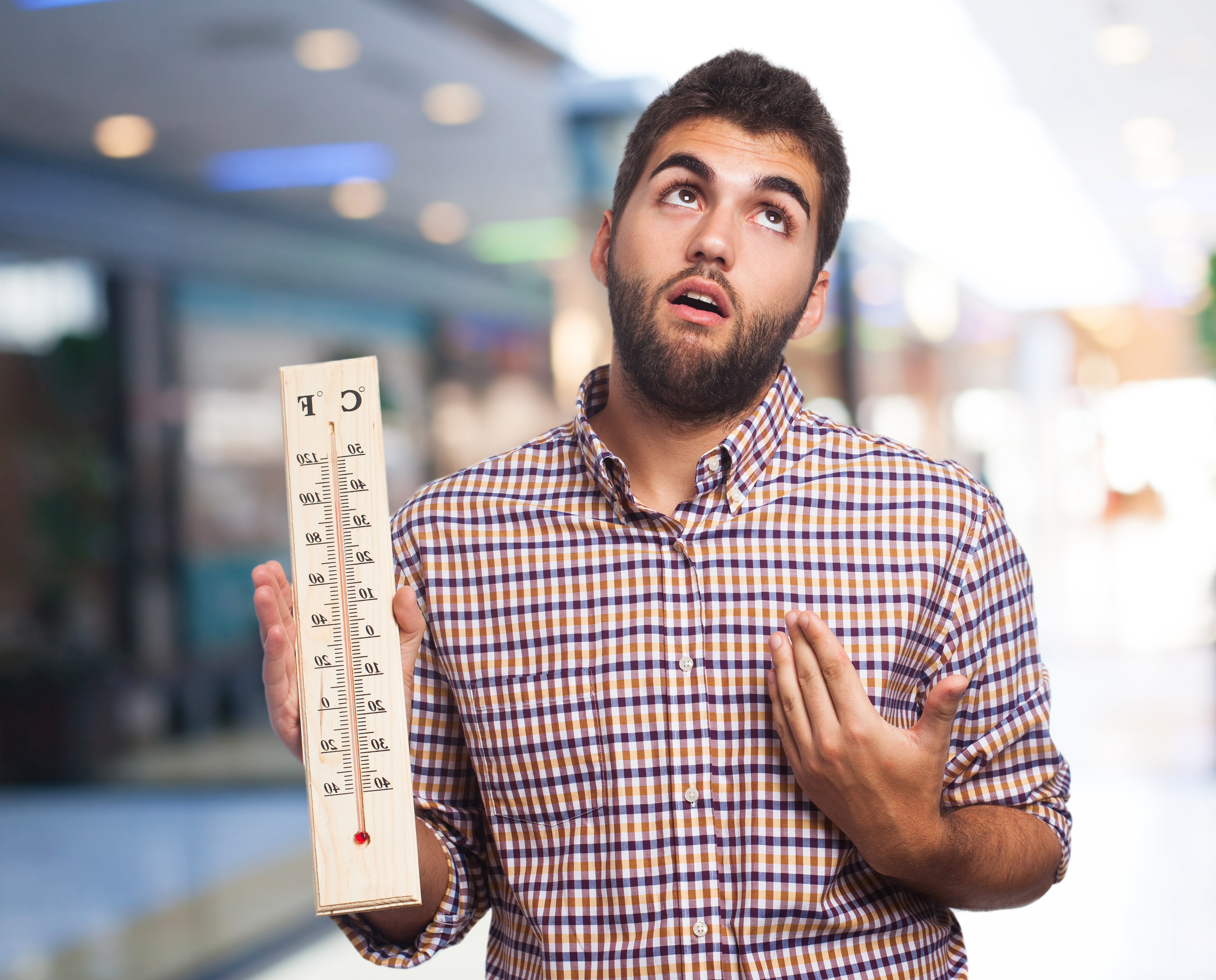 man-with-heat-holding-large-thermometer