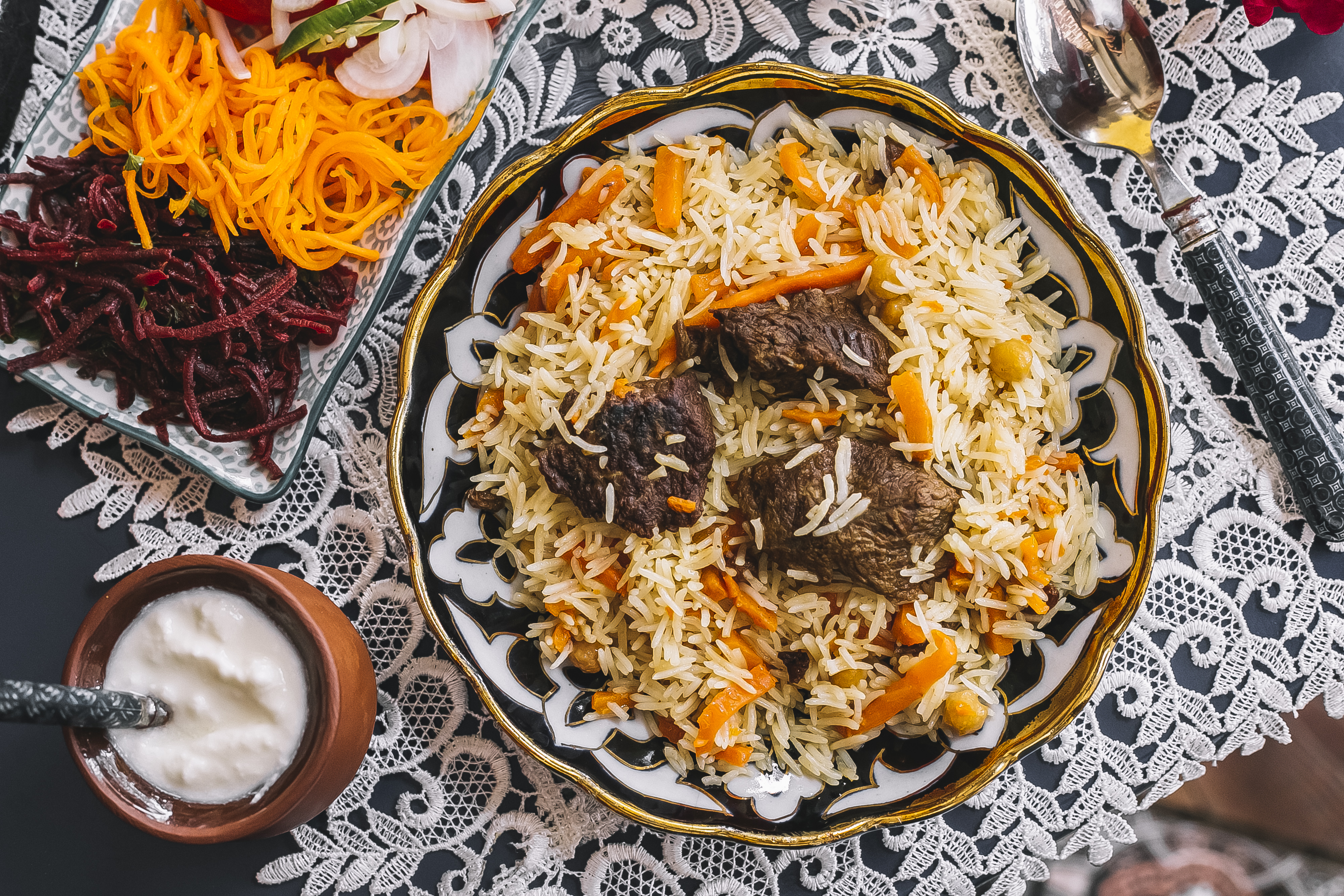 top-view-rice-with-carrot-cooked-with-lamb-served-with-yogurt-salad