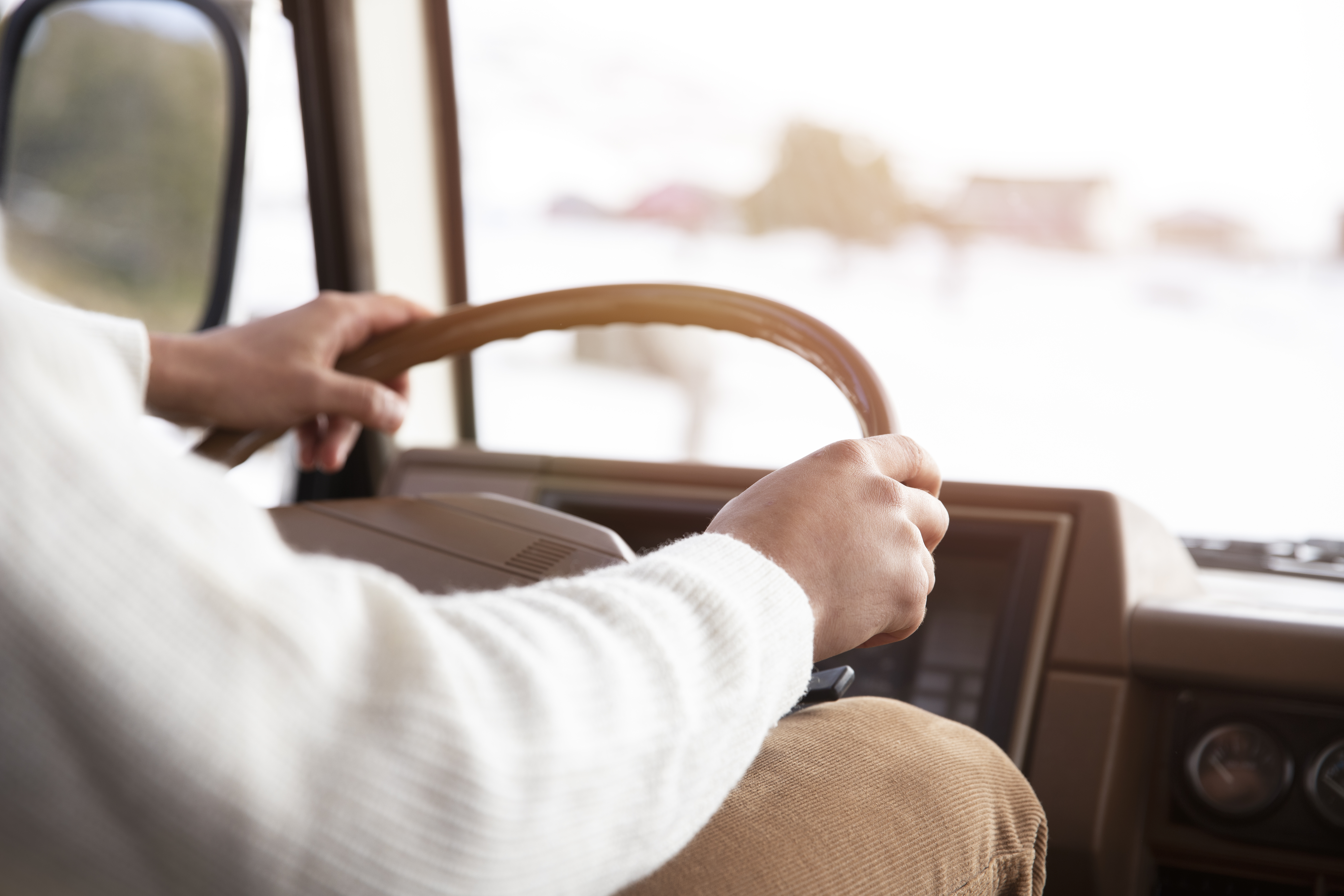 close-up-hands-holding-wheel