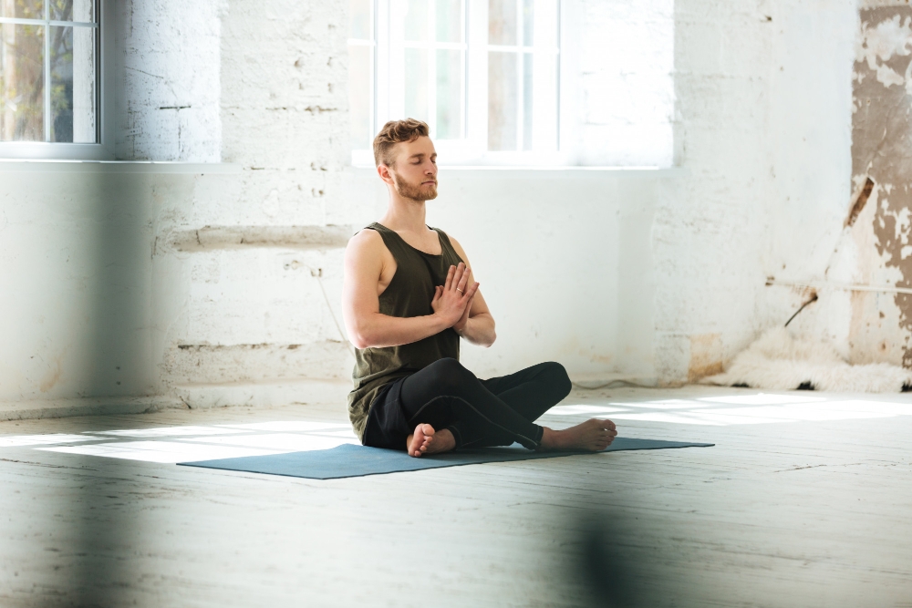Young Candid Man Sitting Fitness Mat