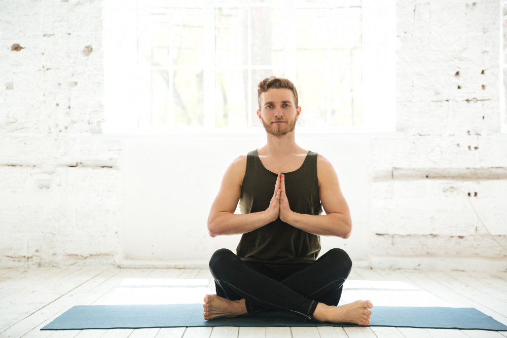 Young Smiling Guy Sitting Fitness Mat Meditating